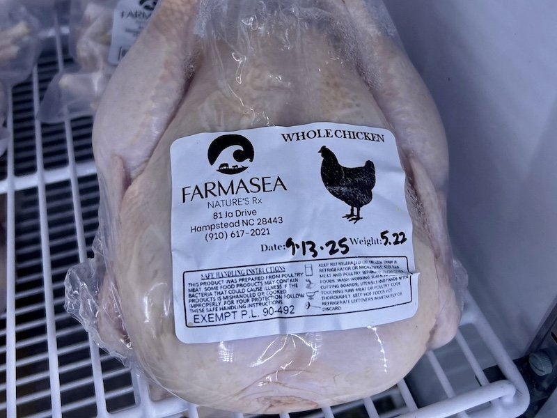 Whole chicken from Farmasea, located in Hampstead, NC, weighing 5.22 pounds. The packaging includes handling instructions and a production date of September 13, 2025.
